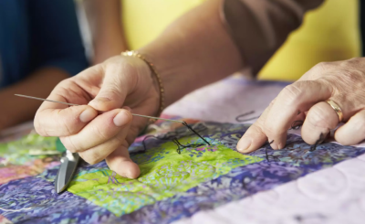 image of someone sewing