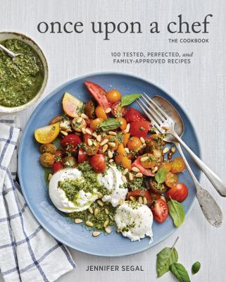 Book Cover:a bowl of salad on a grey counter with a jar of pesto next to it